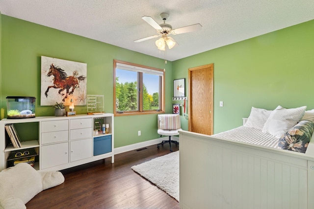 9175 Wedgwood Ln N, Maple Grove, MN 55369 - bedroom with baseboards, dark wood-style floors, a textured ceiling, and ceiling fan