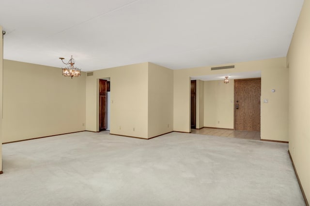 7200 York Ave S Unit 608, Edina, MN 55435 - unfurnished room featuring a chandelier, light colored carpet, and baseboards