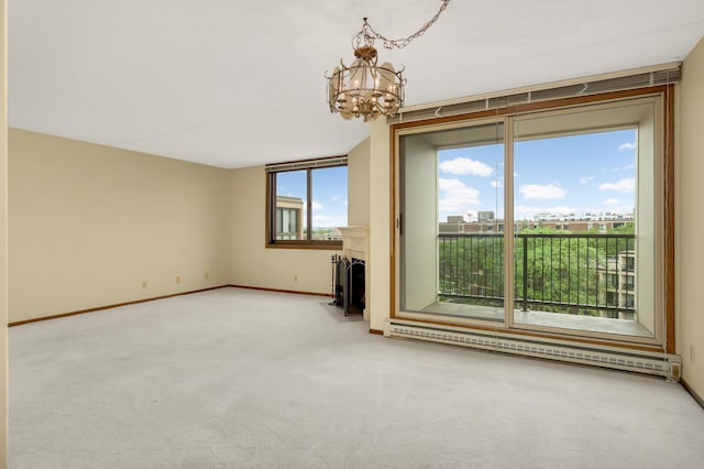 7200 York Ave S Unit 608, Edina, MN 55435 - carpeted empty room with a chandelier, a fireplace with flush hearth, baseboard heating, and baseboards