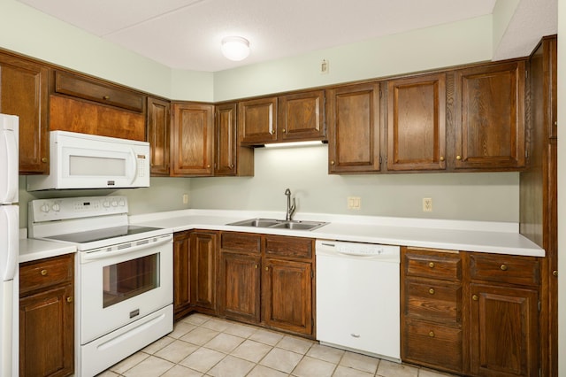 7200 York Ave S Unit 608, Edina, MN 55435 - kitchen with white appliances, a sink, light tile patterned floors, and light countertops