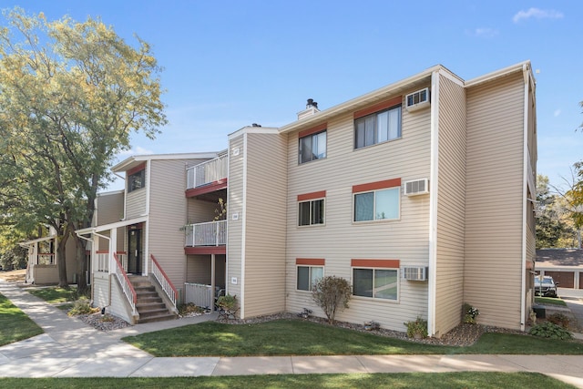 400 Shelard Pkwy Unit 303, Saint Louis Park, MN 55426 - view of building exterior with a wall mounted AC