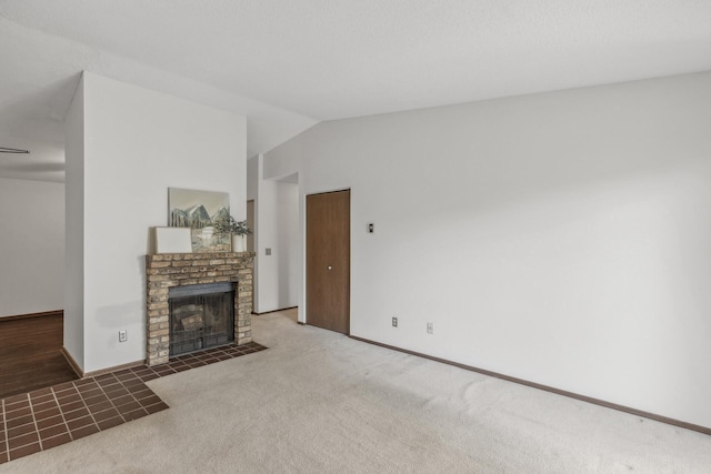 400 Shelard Pkwy Unit 303, Saint Louis Park, MN 55426 - unfurnished living room with a fireplace, lofted ceiling, carpet, and baseboards