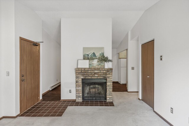 400 Shelard Pkwy Unit 303, Saint Louis Park, MN 55426 - living area featuring lofted ceiling, a baseboard radiator, a brick fireplace, carpet flooring, and baseboards