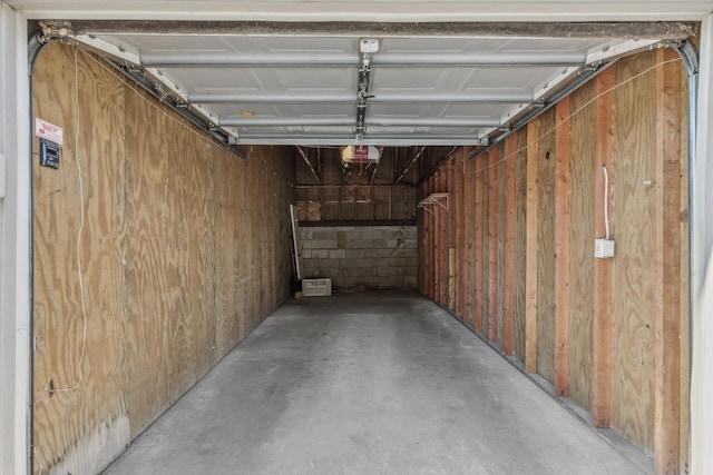 400 Shelard Pkwy Unit 303, Saint Louis Park, MN 55426 - garage with a garage door opener and concrete block wall