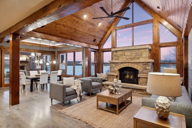 9328 Rhoy Ave, Chaska, MN 55318 - living room with a stone fireplace, high vaulted ceiling, wood finished floors, wood ceiling, and a water view