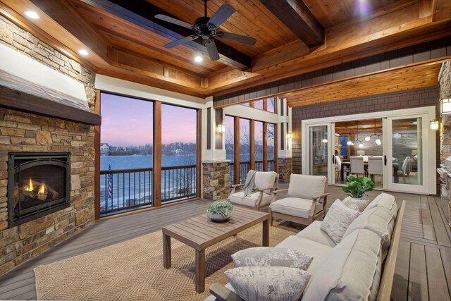 9328 Rhoy Ave, Chaska, MN 55318 - living room featuring wood ceiling with exposed beams, hardwood / wood-style flooring, a fireplace, a water view, and ceiling fan