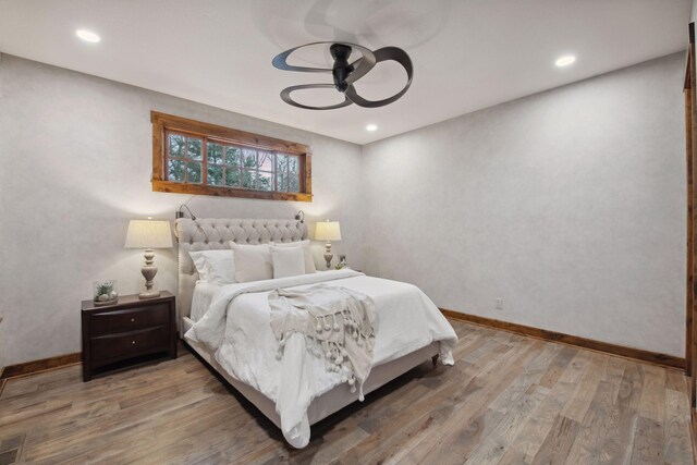 9328 Rhoy Ave, Chaska, MN 55318 - bedroom with wood finished floors, recessed lighting, and baseboards