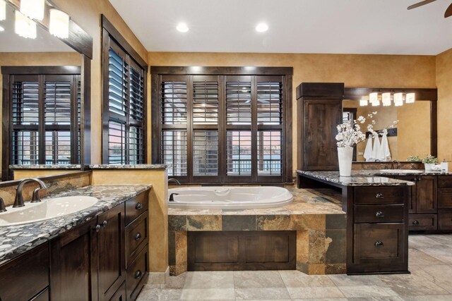 9328 Rhoy Ave, Chaska, MN 55318 - bathroom with two vanities, plenty of natural light, and a bath