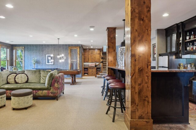 9328 Rhoy Ave, Chaska, MN 55318 - living room with bar area, recessed lighting, pool table, and a chandelier