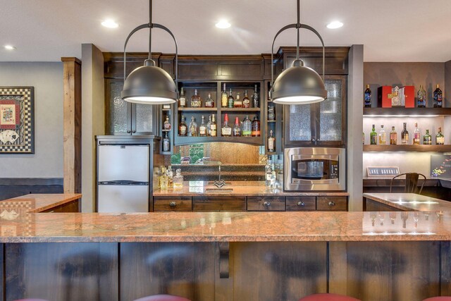 9328 Rhoy Ave, Chaska, MN 55318 - indoor wet bar featuring appliances with stainless steel finishes, recessed lighting, and pendant lighting