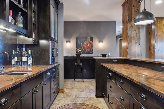 9328 Rhoy Ave, Chaska, MN 55318 - indoor bar with stone finish floors, pendant lighting, stainless steel microwave, and decorative backsplash