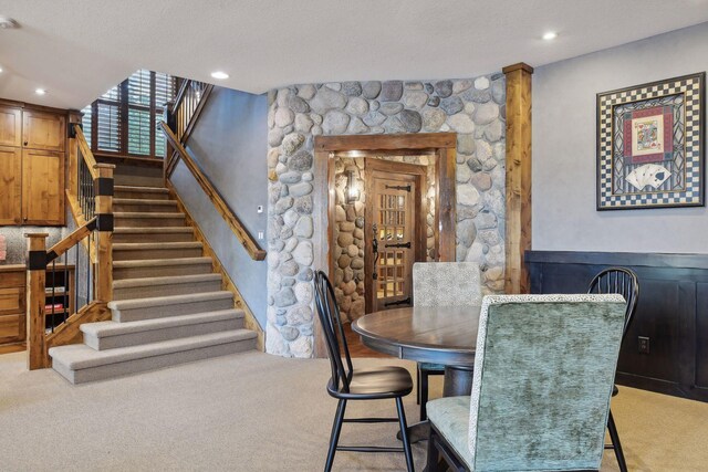 9328 Rhoy Ave, Chaska, MN 55318 - carpeted dining area with stairs, recessed lighting, and a textured ceiling
