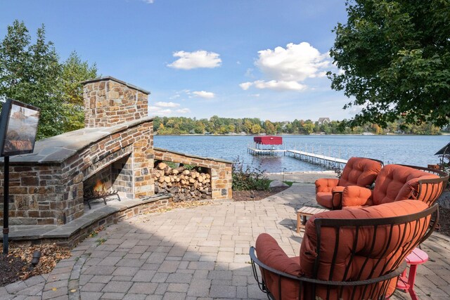 9328 Rhoy Ave, Chaska, MN 55318 - view of patio featuring an outdoor stone fireplace and a water view