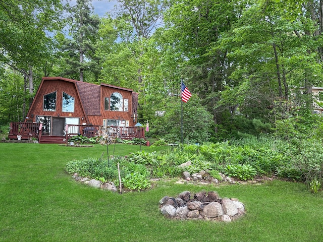 256 22 5/8 Ave, Crystal Lake Twp, WI 54829 - view of front of property featuring a gambrel roof, a deck, and a front yard