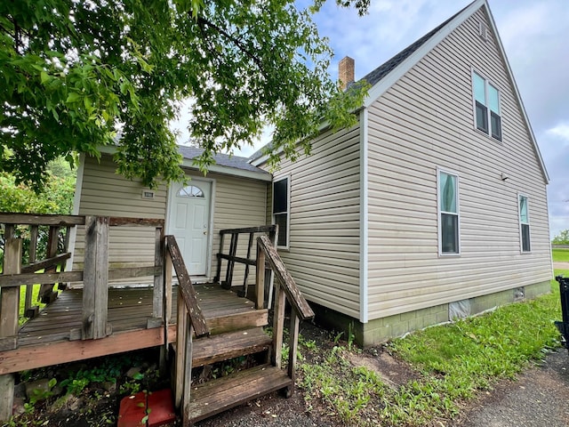 406 1st St S, Hoffman, MN 56339 - rear view of house featuring a deck and a chimney