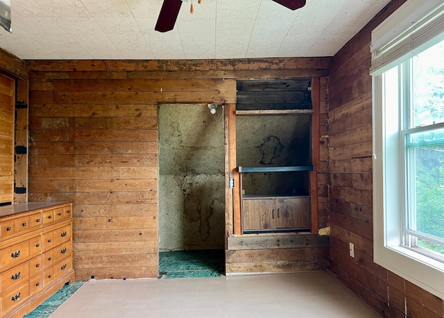 406 1st St S, Hoffman, MN 56339 - unfurnished bedroom with wood walls and ceiling fan