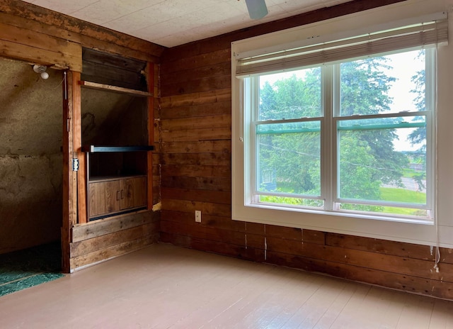 406 1st St S, Hoffman, MN 56339 - spare room featuring wooden walls, healthy amount of natural light, and hardwood / wood-style flooring