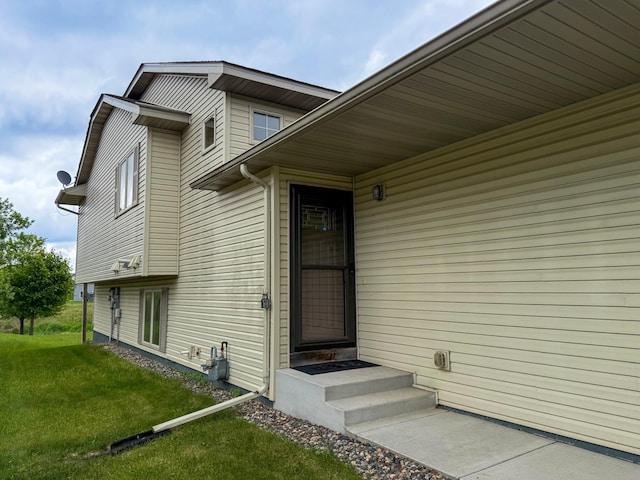 922 Whiskey Rd NW, Isanti, MN 55040 - doorway to property featuring a yard