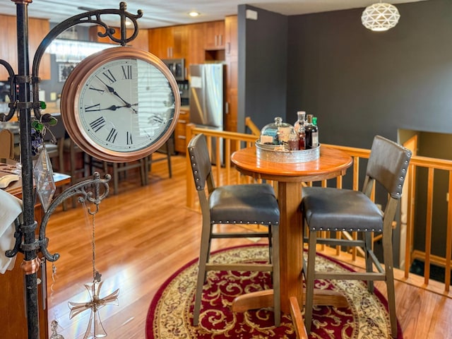 922 Whiskey Rd NW, Isanti, MN 55040 - dining space featuring wood finished floors, recessed lighting, and a chandelier