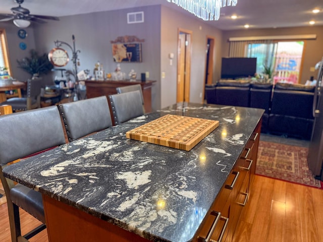 922 Whiskey Rd NW, Isanti, MN 55040 - dining room with ceiling fan and wood finished floors
