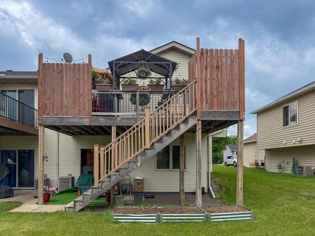922 Whiskey Rd NW, Isanti, MN 55040 - rear view of property featuring a gazebo, a lawn, central AC unit, and a deck