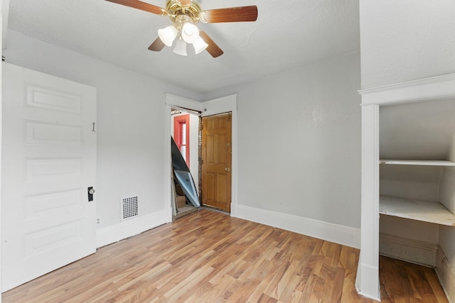 363 Geranium Ave E, Saint Paul, MN 55130 - unfurnished bedroom with light wood-type flooring, baseboards, and ceiling fan