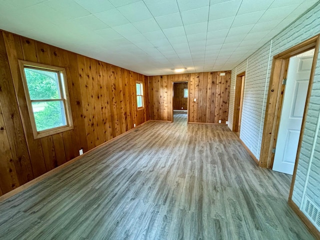 1116 Whitford St, Fergus Falls, MN 56537 - spare room with wood finished floors and wooden walls