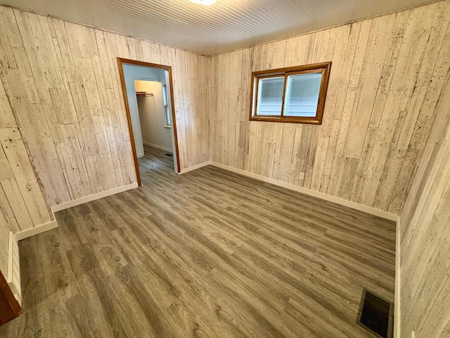 1116 Whitford St, Fergus Falls, MN 56537 - unfurnished room with wood finished floors and wooden walls