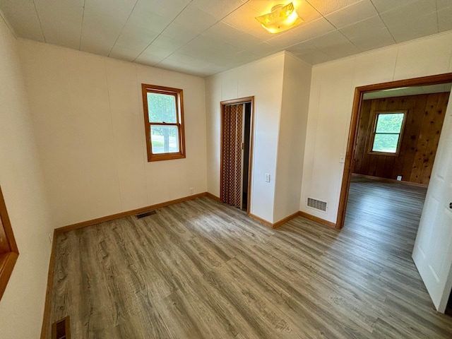 1116 Whitford St, Fergus Falls, MN 56537 - empty room featuring wood finished floors and healthy amount of natural light