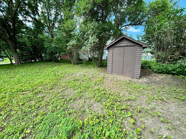1116 Whitford St, Fergus Falls, MN 56537 - view of green lawn featuring a storage unit