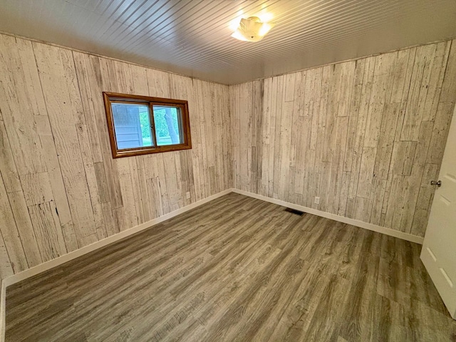 1116 Whitford St, Fergus Falls, MN 56537 - spare room featuring wood finished floors and wooden walls