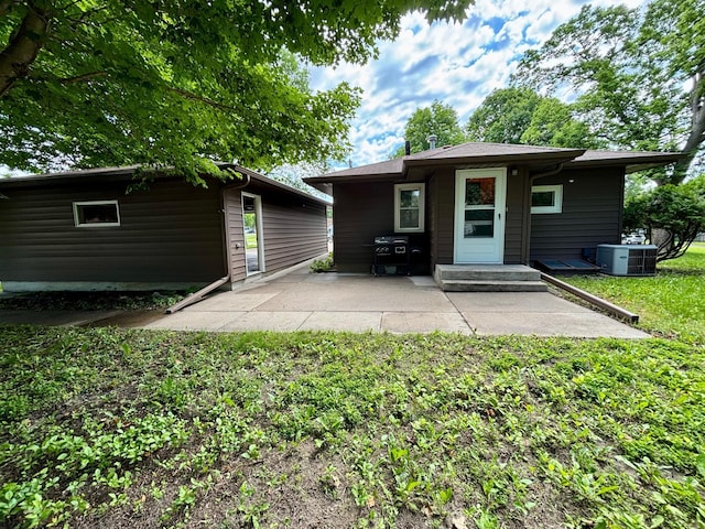 1116 Whitford St, Fergus Falls, MN 56537 - rear view of house featuring a patio and a lawn