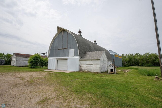 5555 167th Ave SE, Walcott, ND 58051 - view of barn featuring a yard and driveway