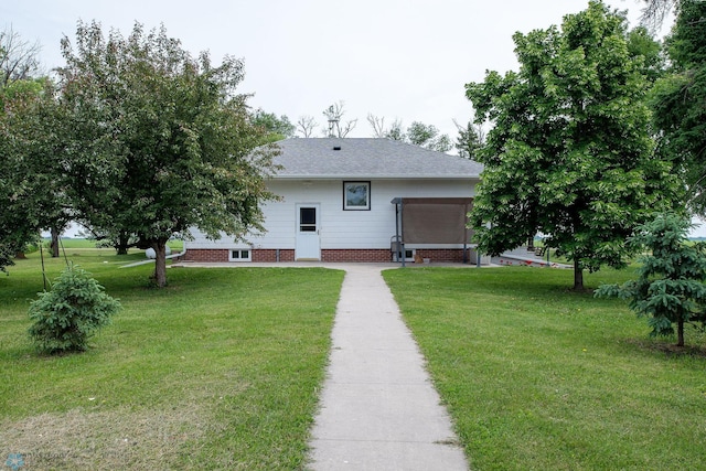 5555 167th Ave SE, Walcott, ND 58051 - back of property with a lawn and roof with shingles
