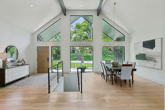6608 Pawnee Rd, Edina, MN 55439 - dining space featuring wood finished floors, high vaulted ceiling, and beam ceiling