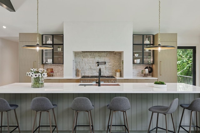 6608 Pawnee Rd, Edina, MN 55439 - kitchen with tasteful backsplash, glass insert cabinets, light countertops, pendant lighting, and recessed lighting