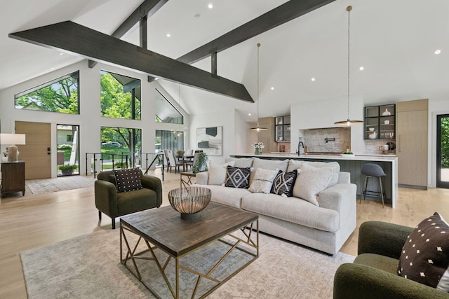6608 Pawnee Rd, Edina, MN 55439 - living area with high vaulted ceiling, beam ceiling, and light wood-style flooring