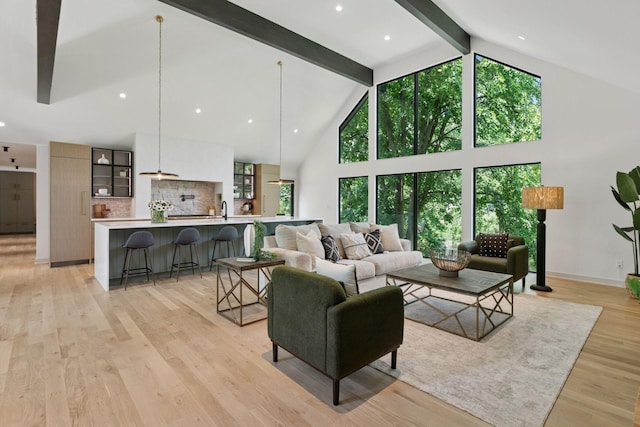6608 Pawnee Rd, Edina, MN 55439 - living room with high vaulted ceiling, beam ceiling, plenty of natural light, and light wood-style flooring