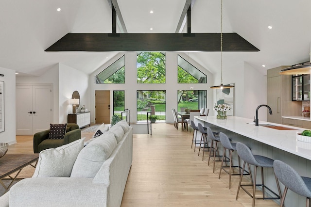 6608 Pawnee Rd, Edina, MN 55439 - living room with beamed ceiling, light wood-type flooring, high vaulted ceiling, and recessed lighting