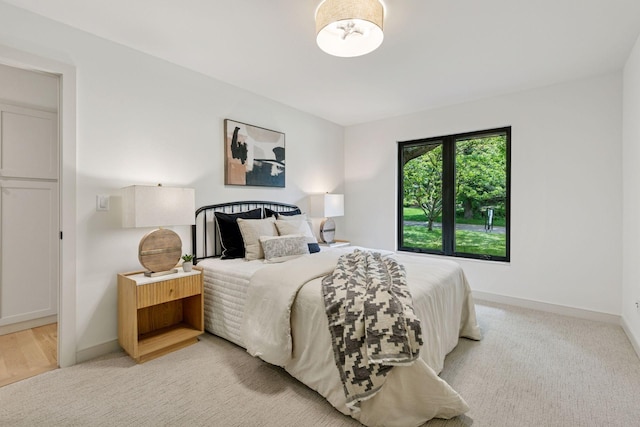6608 Pawnee Rd, Edina, MN 55439 - bedroom featuring baseboards and light colored carpet