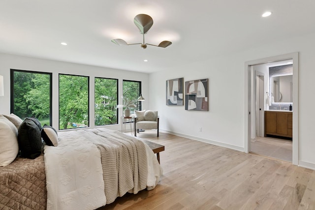 6608 Pawnee Rd, Edina, MN 55439 - bedroom with light wood-type flooring, recessed lighting, and ensuite bath