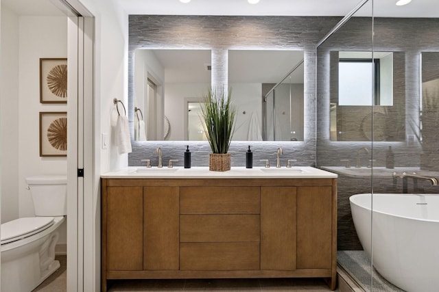 6608 Pawnee Rd, Edina, MN 55439 - bathroom with a freestanding bath, double vanity, and decorative backsplash