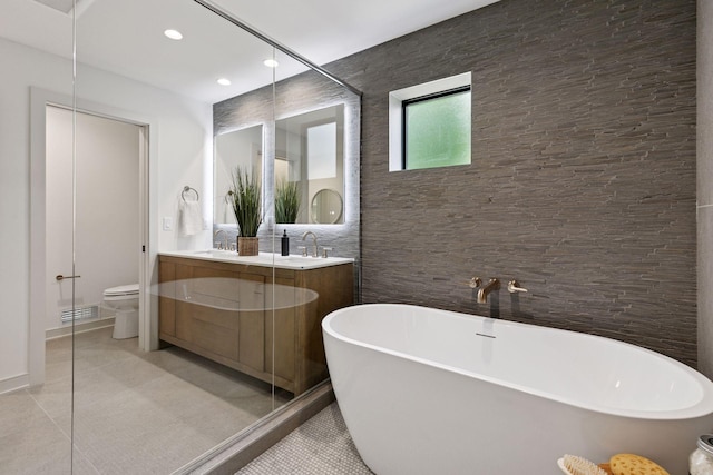 6608 Pawnee Rd, Edina, MN 55439 - bathroom with double vanity, a freestanding tub, recessed lighting, and tile patterned flooring