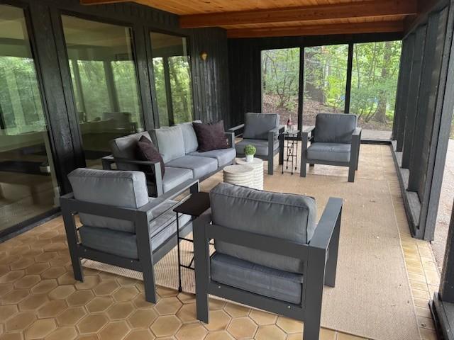 6608 Pawnee Rd, Edina, MN 55439 - sunroom with an outdoor living space, healthy amount of natural light, beamed ceiling, and french doors
