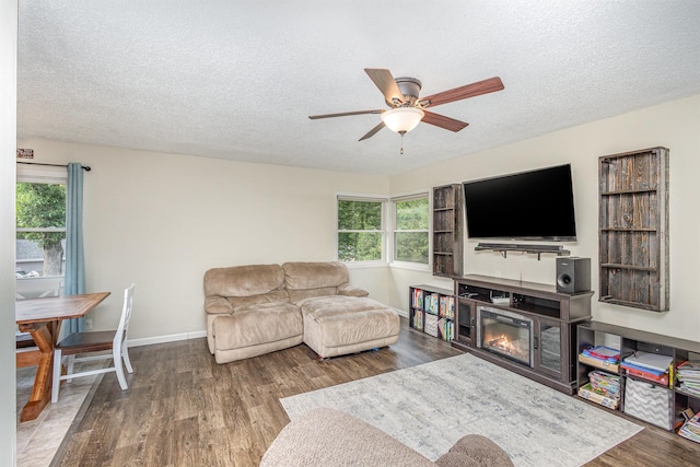 15326 11th St S, Afton, MN 55001 - living area with a textured ceiling, ceiling fan, wood finished floors, and plenty of natural light