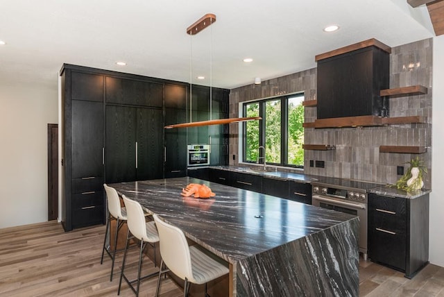 19923 See Gull Rd, Brainerd, MN 56401 - kitchen with open shelves, tasteful backsplash, modern cabinets, dark cabinetry, and recessed lighting