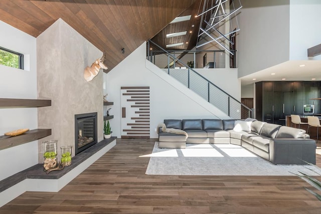 19923 See Gull Rd, Brainerd, MN 56401 - living area featuring high vaulted ceiling, stairway, wood finished floors, wood ceiling, and a large fireplace