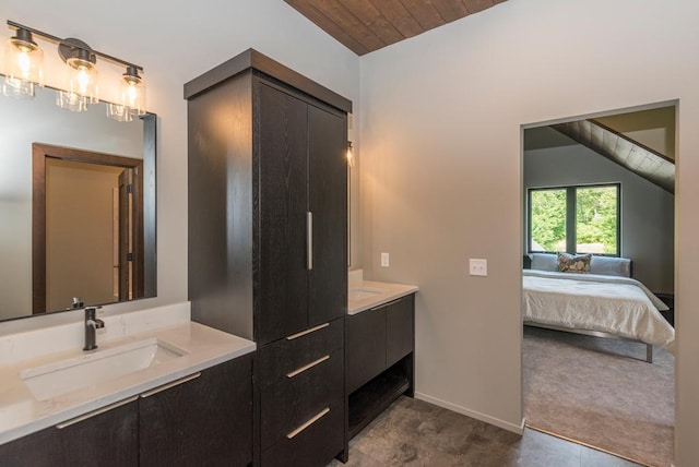 19923 See Gull Rd, Brainerd, MN 56401 - full bathroom featuring two vanities, connected bathroom, baseboards, lofted ceiling, and wooden ceiling