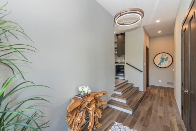 19923 See Gull Rd, Brainerd, MN 56401 - stairs featuring beverage cooler, wood finished floors, recessed lighting, and baseboards