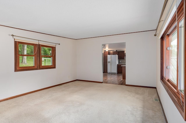 W7324 State Road 65, Trimbelle, WI 54003 - spare room featuring carpet flooring and baseboards